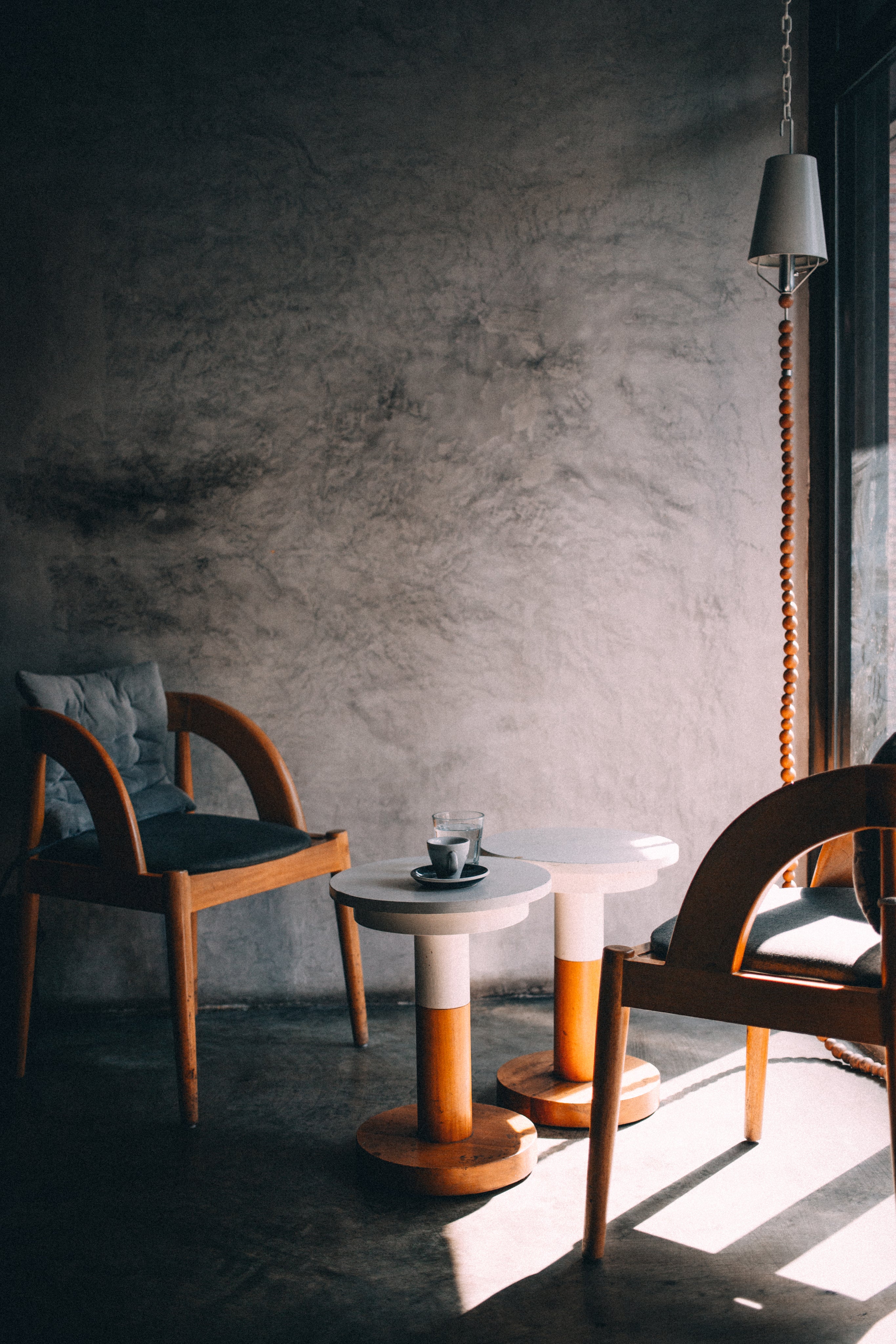 bare-stony-room-with-two-wooden-benches-and-coffee-tables.jpg